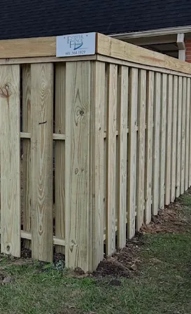 Detailed view of vertical wooden pickets on a privacy fence.